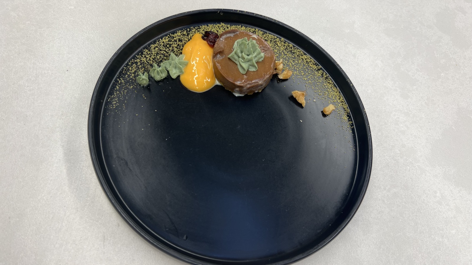 Chocolate mousse on black plate