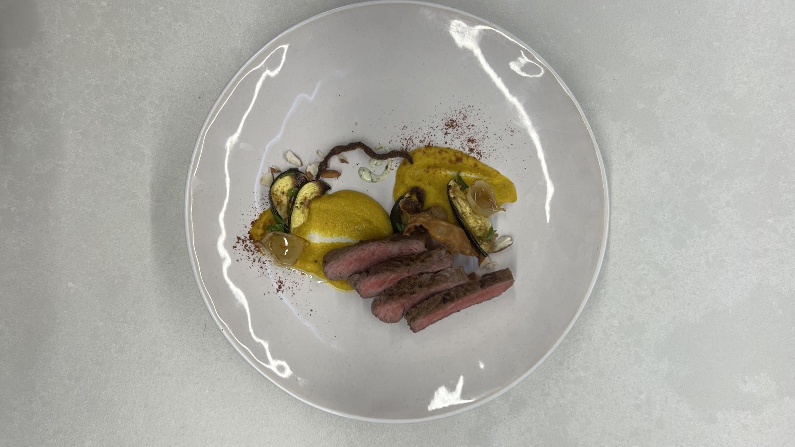 Sliced steak with saffron puree