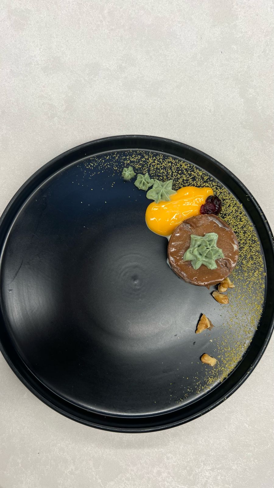 Chocolate dessert on black plate